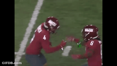 Two Football Players Hugging Number 4 Jersey GIF