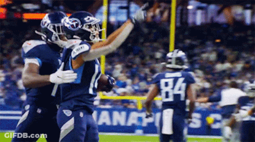 Two Football Players Hugging Number 84 GIF