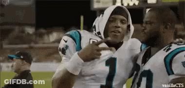 Two Football Players Hugging On Field GIF