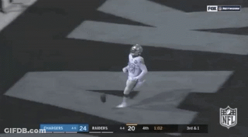 Two Football Players Laying On Ground NFL Touchdown GIF