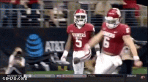 Two Football Players Number 5 And 6 Running GIF