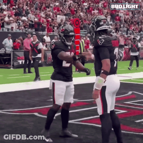 Two Football Players On A Field With A Bud Light Logo On The Bottom GIF