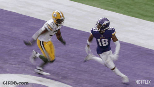 Two Football Players On A Field With Netflix Written On The Bottom GIF
