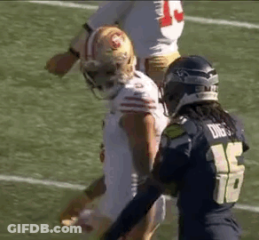 Two Football Players On Field During Game GIF