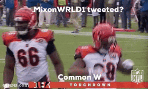 Two Football Players On Field Mixon Wrld Tweeted GIF