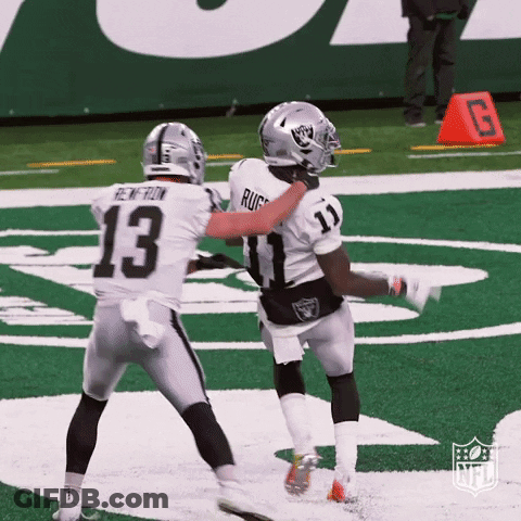 Two Football Players On Field Number 13 GIF