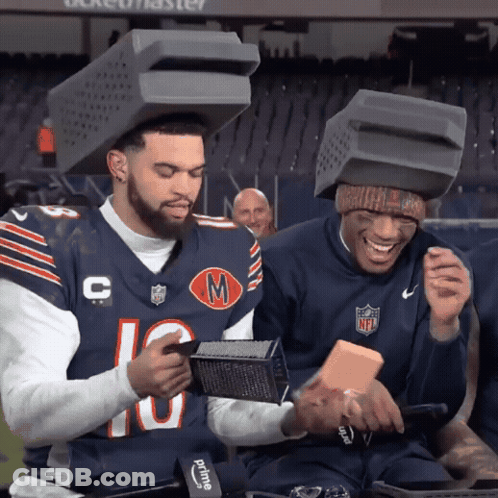 Two Football Players With Boxes On Heads Number 10 GIF