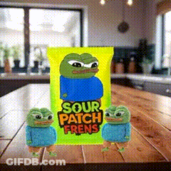 Two Frogs Are Standing Next To A Bag Of Sour Patch Frens On A Table . GIF