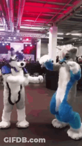 Two Furry Costumes Standing Next To Each Other GIF
