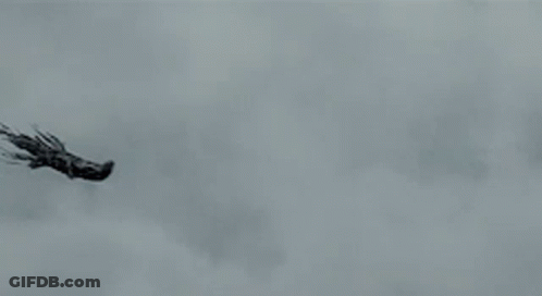 Two Ghosts Are Flying Through The Air In A Cloudy Sky GIF