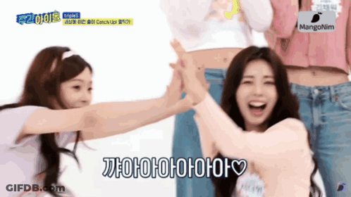 Two Girls Are Giving Each Other A High Five And One Of Them Is Saying ' Aoaoaoaoaa ' GIF