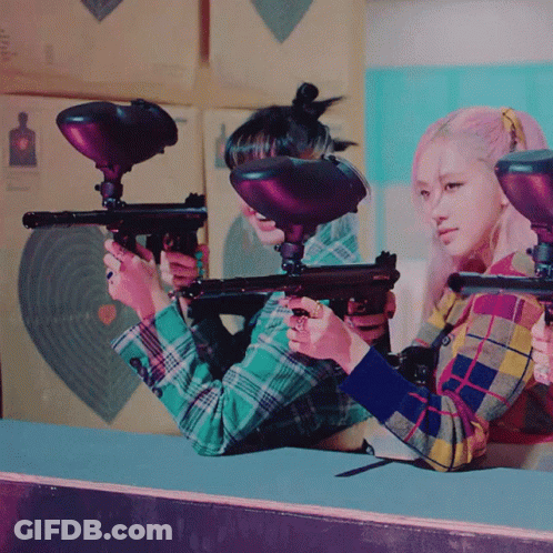 Two Girls Holding Paintball Guns GIF