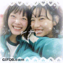 Two Girls Are Posing For A Picture And One Of Them Has A Cross In Her Nose GIF