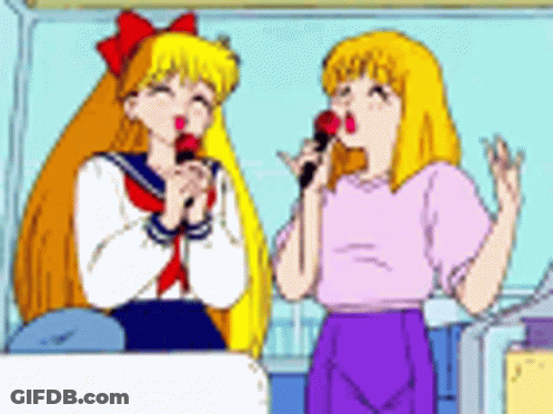 Two Girls Are Singing Into Microphones In A Cartoon GIF