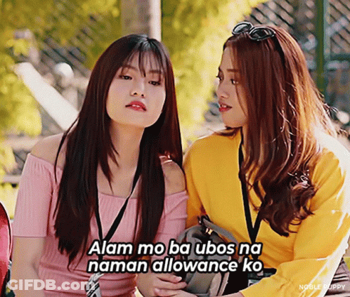 Two Girls Sitting With Ubo Naman Allowance Caption GIF