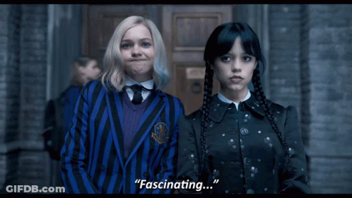 Two Girls Are Standing Next To Each Other And One Of Them Is Saying Fascinating GIF
