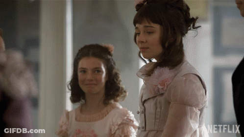 Two Girls Are Standing Next To Each Other With Netflix Written On The Bottom Right GIF