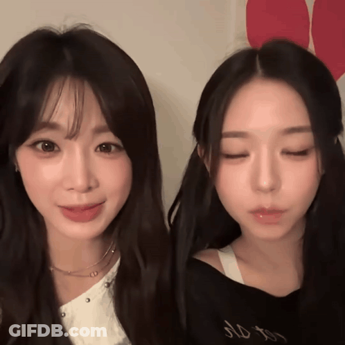 Two Girls Are Standing Next To Each Other With One Wearing A Black Shirt That Says No To GIF