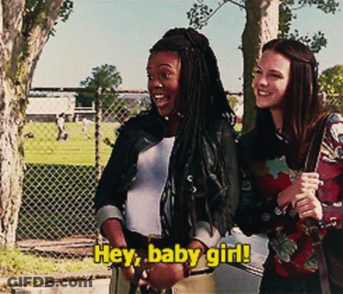 Two Girls Are Standing Next To Each Other With The Words Hey Baby Girl Written On The Bottom GIF