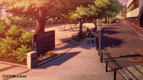 Two Girls Are Walking Down A Sidewalk Next To A Sign That Says No Smoking GIF