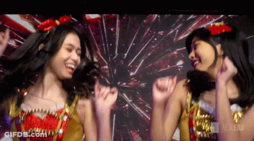Two Girls Dancing In Front Of Fireworks Cinema GIF
