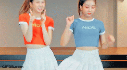 Two Girls Dancing One Wearing Hidal Shirt GIF