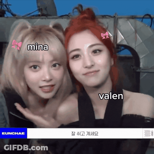 Two Girls Glasses Ear Muffs Hold Boxes 283 GIF