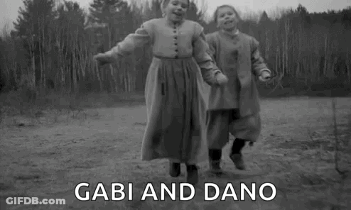 Two Girls Holding Hands Jumping GIF