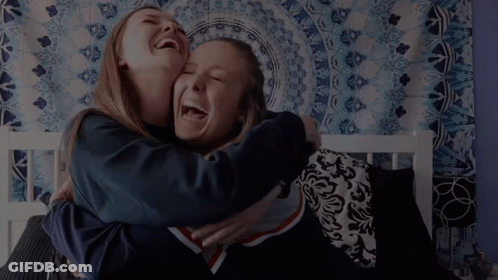 Two Girls Hugging And Laughing Saying Hi GIF