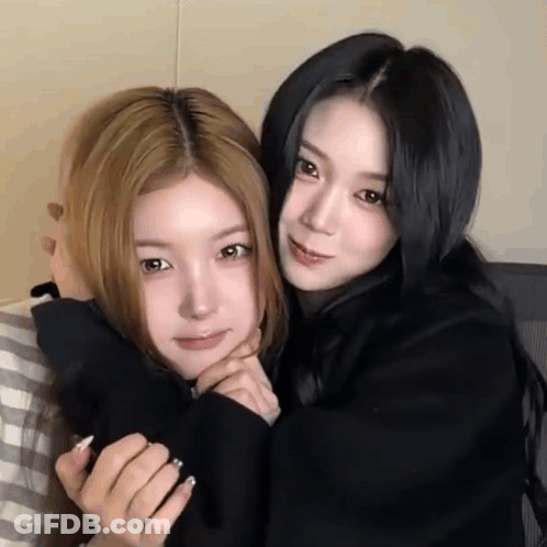 Two Girls Hugging One In Black Shirt GIF