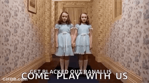 Two Girls In Blue Dresses In Hallway GIF