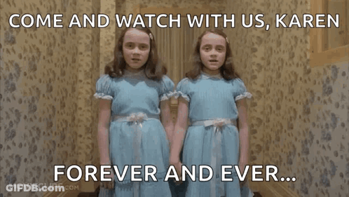 Two Girls In Blue Dresses Watching Together GIF