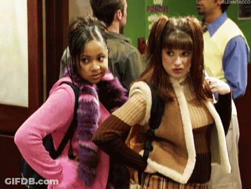 Two Girls In Hallway With Man Behind GIF