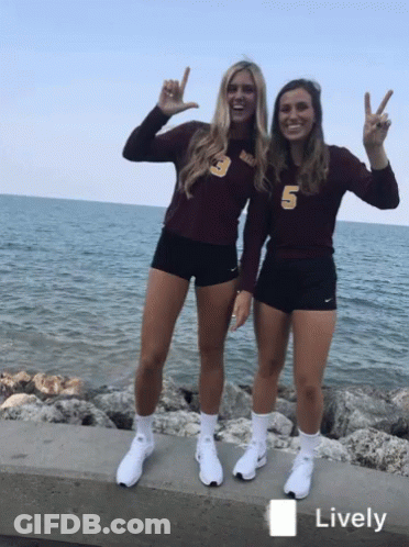 Two Girls In Maroon Number 5 Shirts GIF