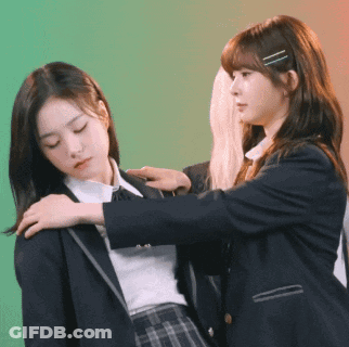 Two Girls In School Uniforms Are Standing Next To Each Other And One Is Putting Her Hand On The Other 'S Shoulder GIF