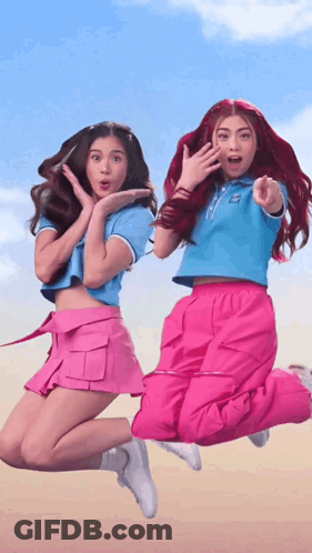 Two Girls Jumping One Pointing GIF