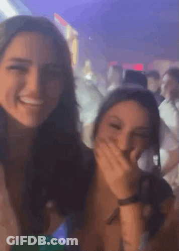 Two Girls Laughing Covering Mouths GIF