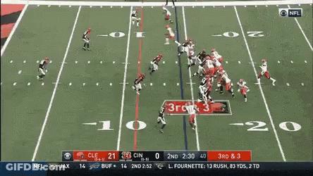 Two Girls Looking At Each Other Give The Ball To Nick Chubb GIF