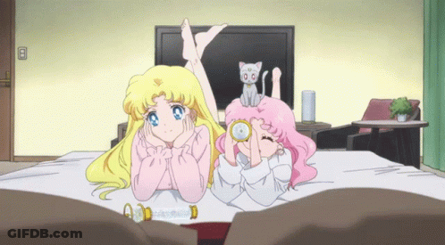 Two Girls Lying On Bed With Cat GIF