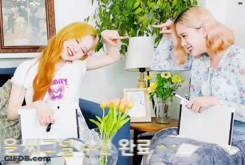 Two Girls On Couch With Mighty Shirt GIF