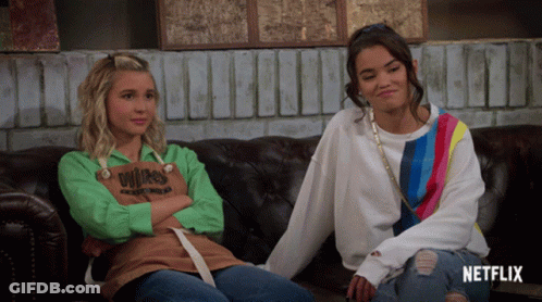 Two Girls On Couch With Netflix Written On Bottom GIF