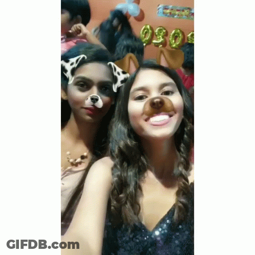 Two Girls Posing One With Dog Face Mask GIF