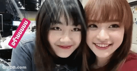 Two Girls Posing With Sticker Saying A GIF