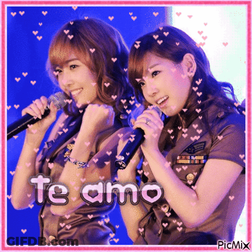 Two Girls Singing Into Microphones With The Words Te Amo On The Bottom Right GIF