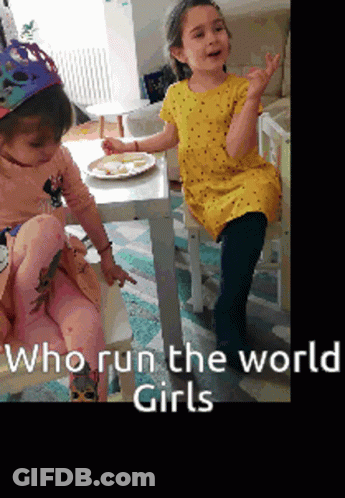 Two Girls Sitting At Table With Who Run The World Girls GIF