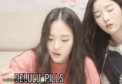 Two Girls Sitting Next To Each Other GIF