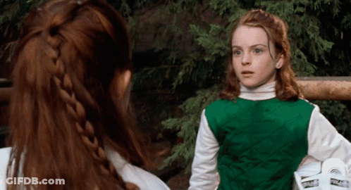 Two Girls Standing Next To Each Other GIF