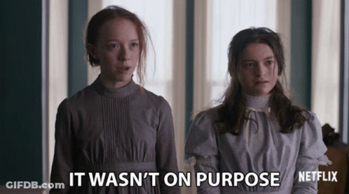 Two Girls Standing Next To Each Other With The Words " It Wasn 'T On Purpose " Written On The Bottom GIF