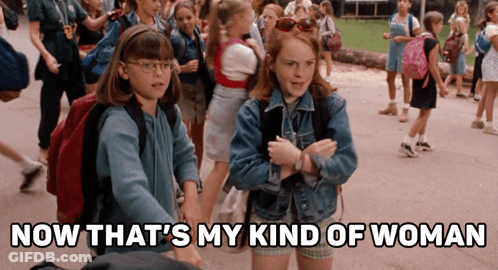 Two Girls Standing Next To Each Other With The Words Now That 'S My Kind Of Woman GIF