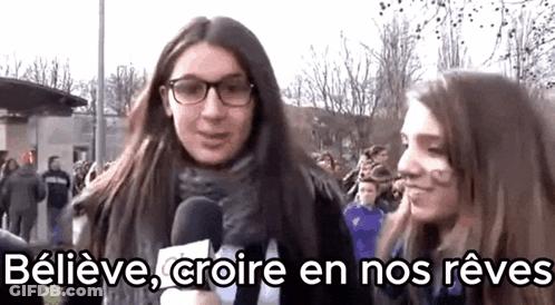 Two Girls Talking Into Microphones Believe Croire En Nos Reves GIF
